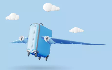 Flying suitcase on blue background